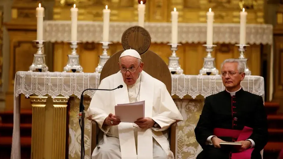Pope Francis delivers the homily as he leads vespers in the Cathedral of Notre Dame in Quebec July 28, 2022. Seated at right is Msgr. Diego Giovanni Ravelli, master of papal liturgical ceremonies