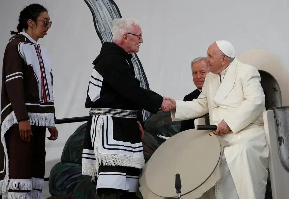 Elder Piita Irniq and youth drum dancer Malachai Angulalik Mala present Pope Francis with a traditional drum during a meeting with young people and elders outside the primary school in Iqaluit in the Canadian territory of Iqaluit, Nunavut. It was the final day of the pope's weeklong visit to Canada, where he met with Indigenous peoples and apologized for the Catholic Church's role in residential schools