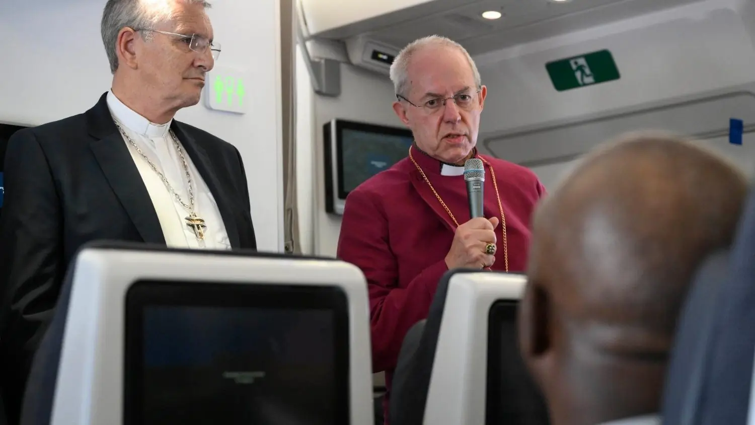 Anglican Archbishop Justin Welby (R) with Rt. Rev. Iain Greenshields aboard the papal plane
